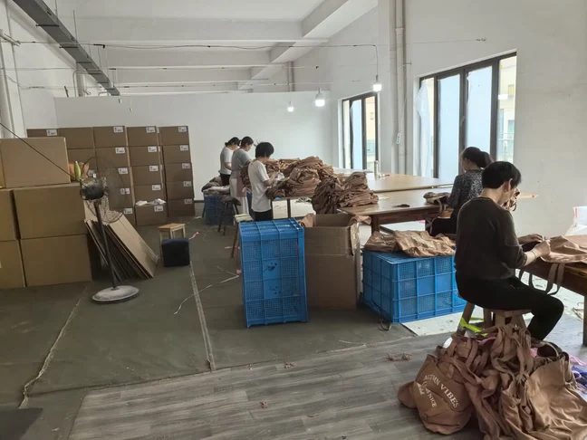 Preparation and packing at the Feima bag factory, Jinhua China