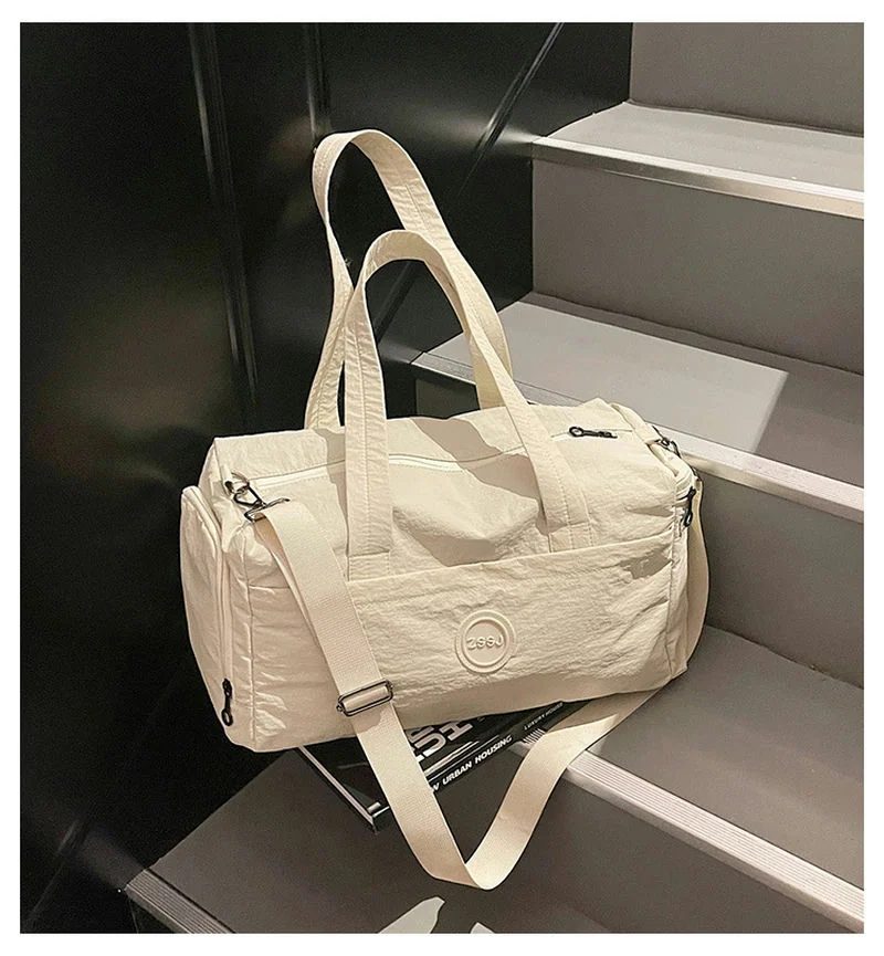Duffel with a round front label and long handles FS-006 by Feima Bag