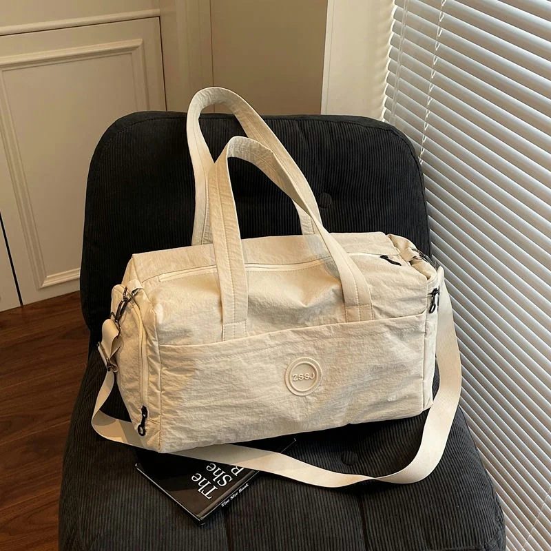Duffel with a round front label and long handles FS-006 by Feima Bag